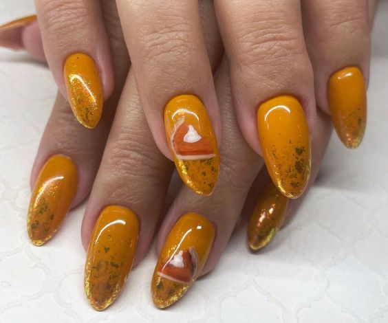 Seasonal pumpkin pie nails with yellow and orange color combination