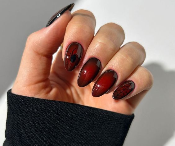 Vampire red aura nail art and spider design for Halloween. 