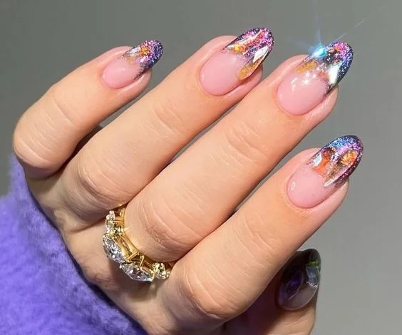 Colorful glitter ombre tips with rhinestones nail art.