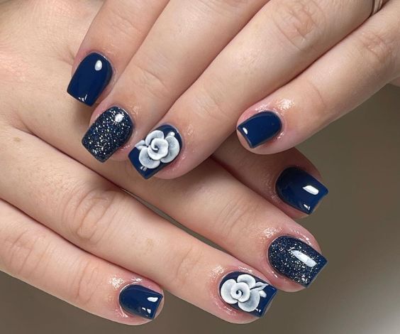 Navy blue coffin nails with swirl patterns. 