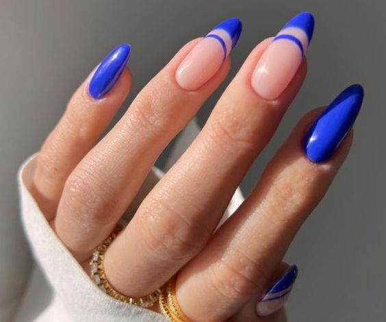 Royal blue almondetto nails with double French tips. 