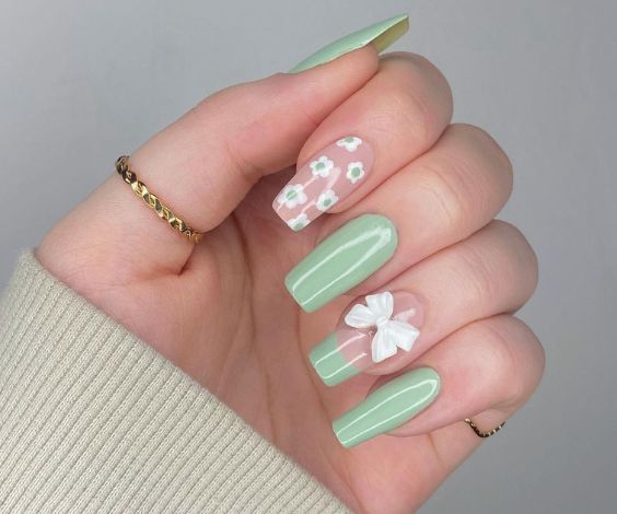 Coquette nail art with sage green nail color. 