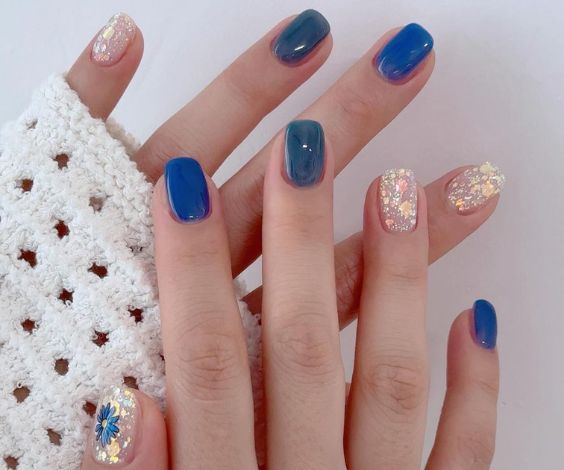 Cute short squoval nails with white and blue jelly nail polish. 