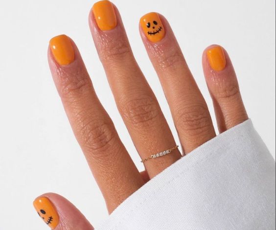 Simple short nail color and cute emojis. 