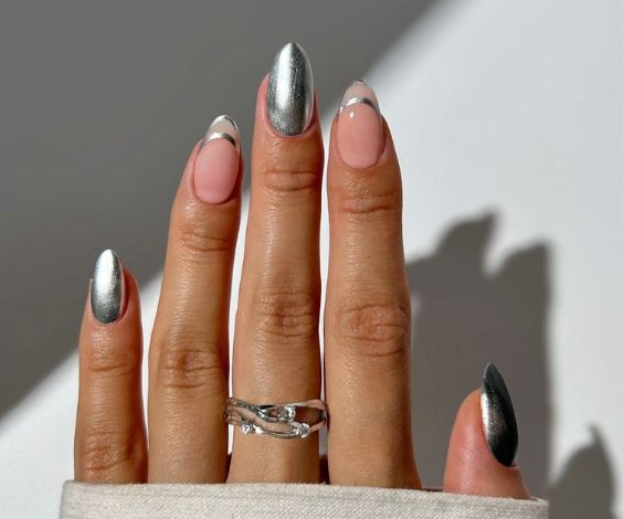 Metallic silver chrome nail art for almond nails. 