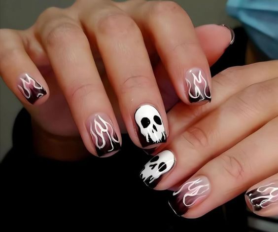 Scary and spooky season nail art for short almond nails. 