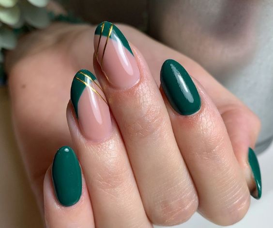 Forest green nails with gold stripe tapes nail art. 
