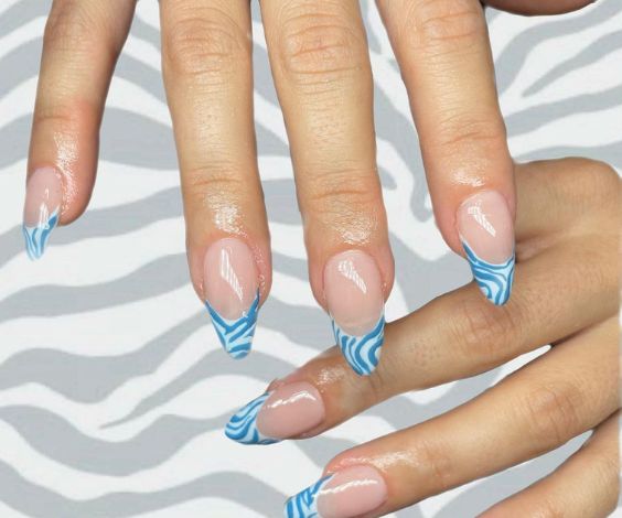 French tips with blue and white swirl pattern. 