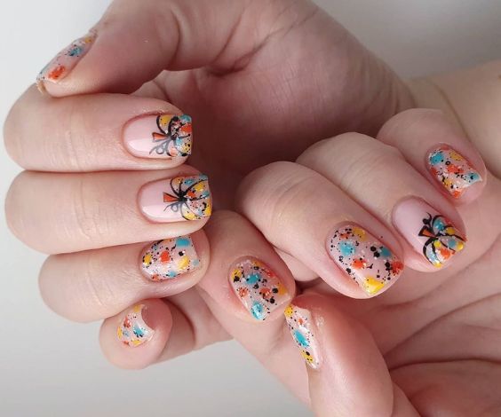 Short nails with colorful pumpkin design