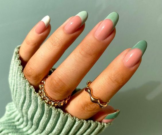 Gradient French tips with sage green nail colors. 