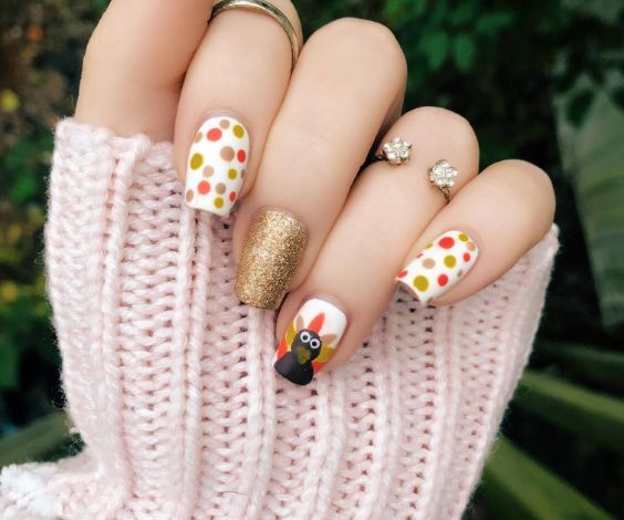  White nails with turkey and dot patterns 